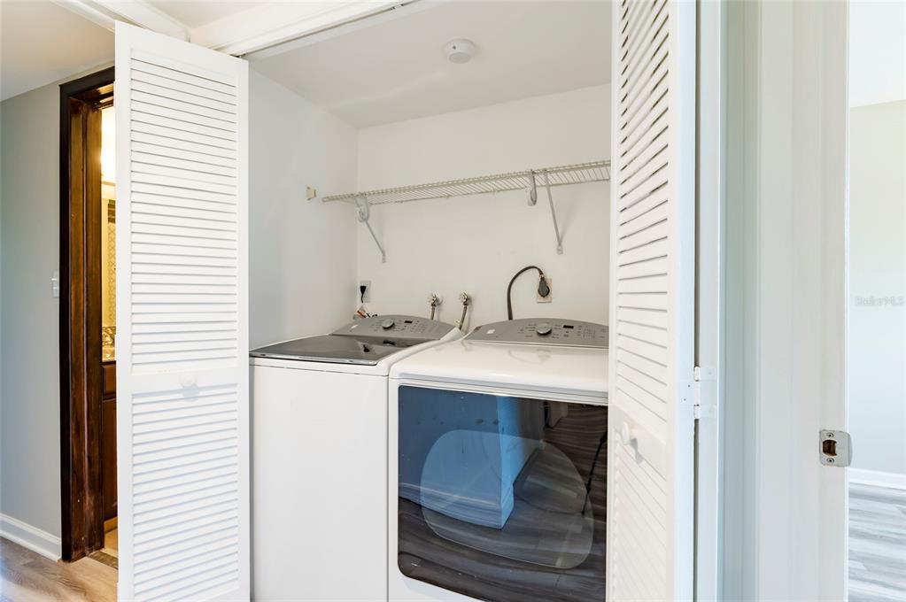 735 South Village Drive, Unit 206 St. Petersburg, FL 33716 - Photo 23 of 45 a utility room with dryer and washer