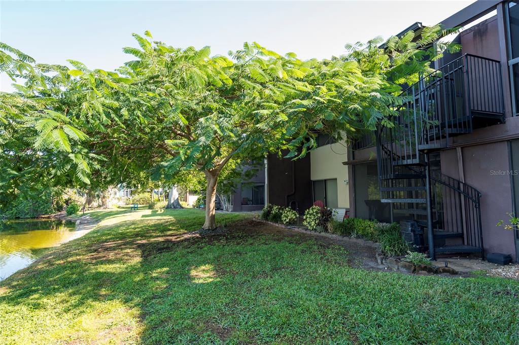 735 South Village Drive, Unit 206 St. Petersburg, FL 33716 - Photo 32 of 45 a house is sitting in middle od the grass