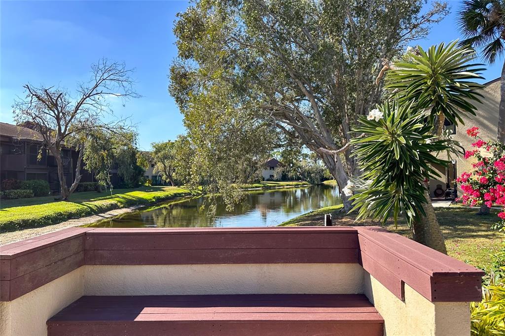 735 South Village Drive, Unit 206 St. Petersburg, FL 33716 - Photo 43 of 45 a view of a yard with potted plants and trees