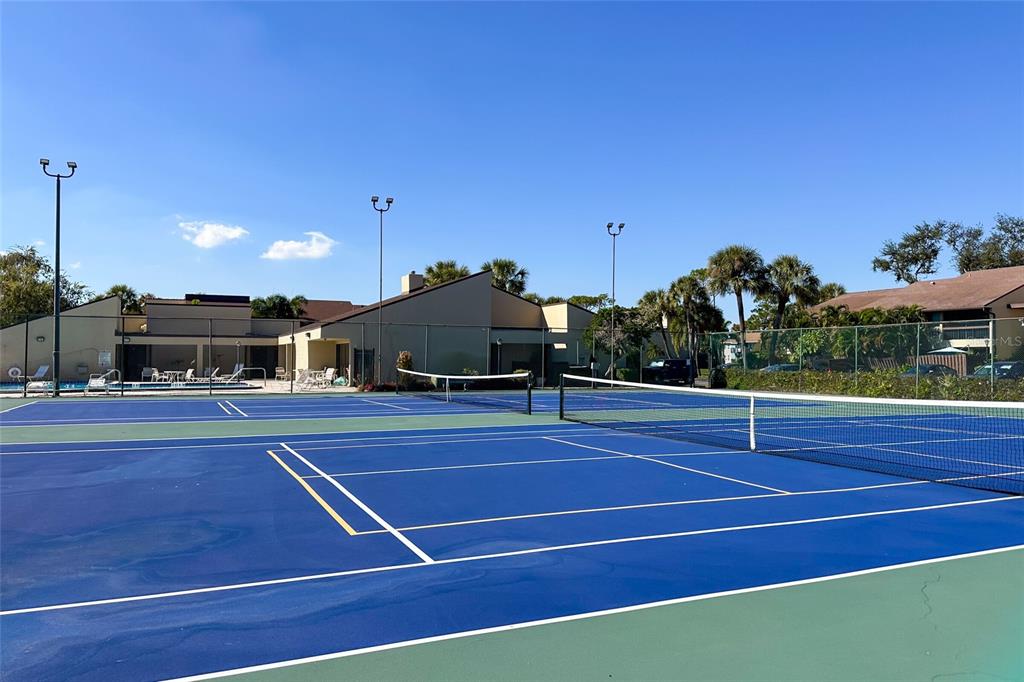 735 South Village Drive, Unit 206 St. Petersburg, FL 33716 - Photo 44 of 45 a view of a tennis court
