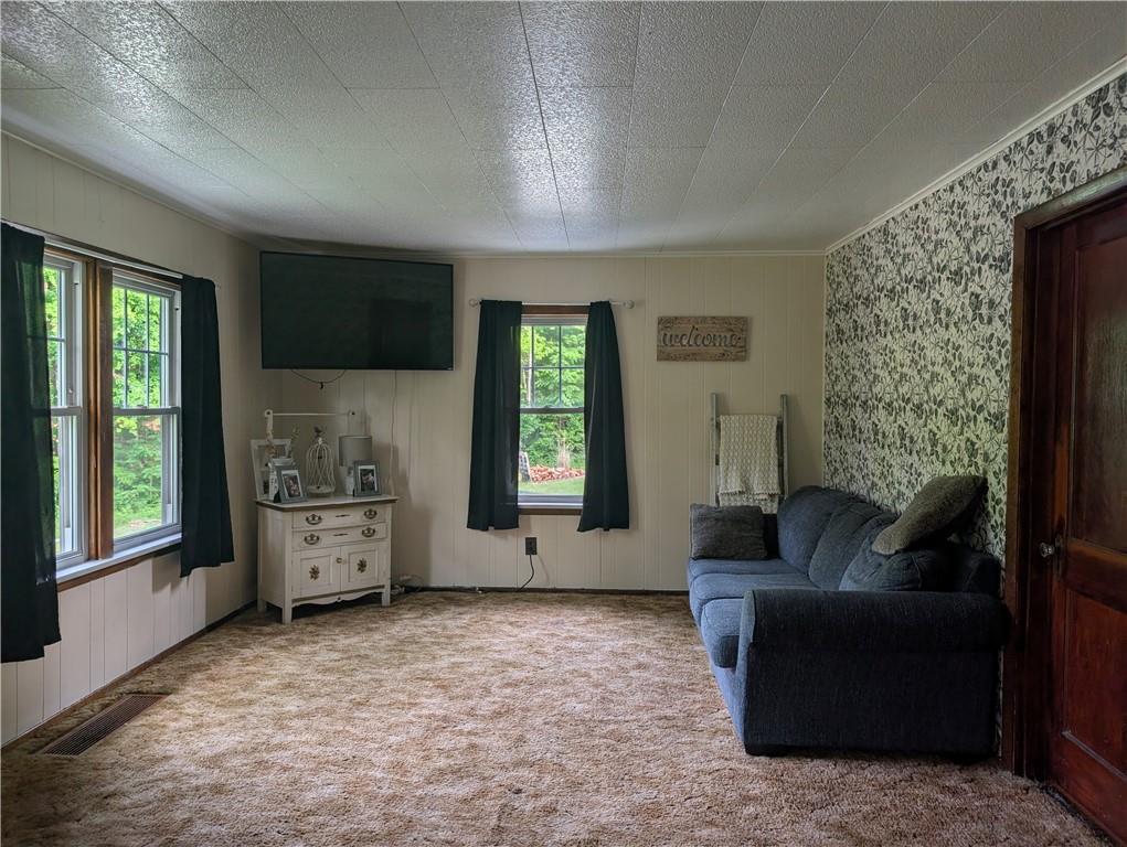 205 Woods Road Ligonier, PA 15658 - Photo 8 of 32 a living room with furniture and a large window