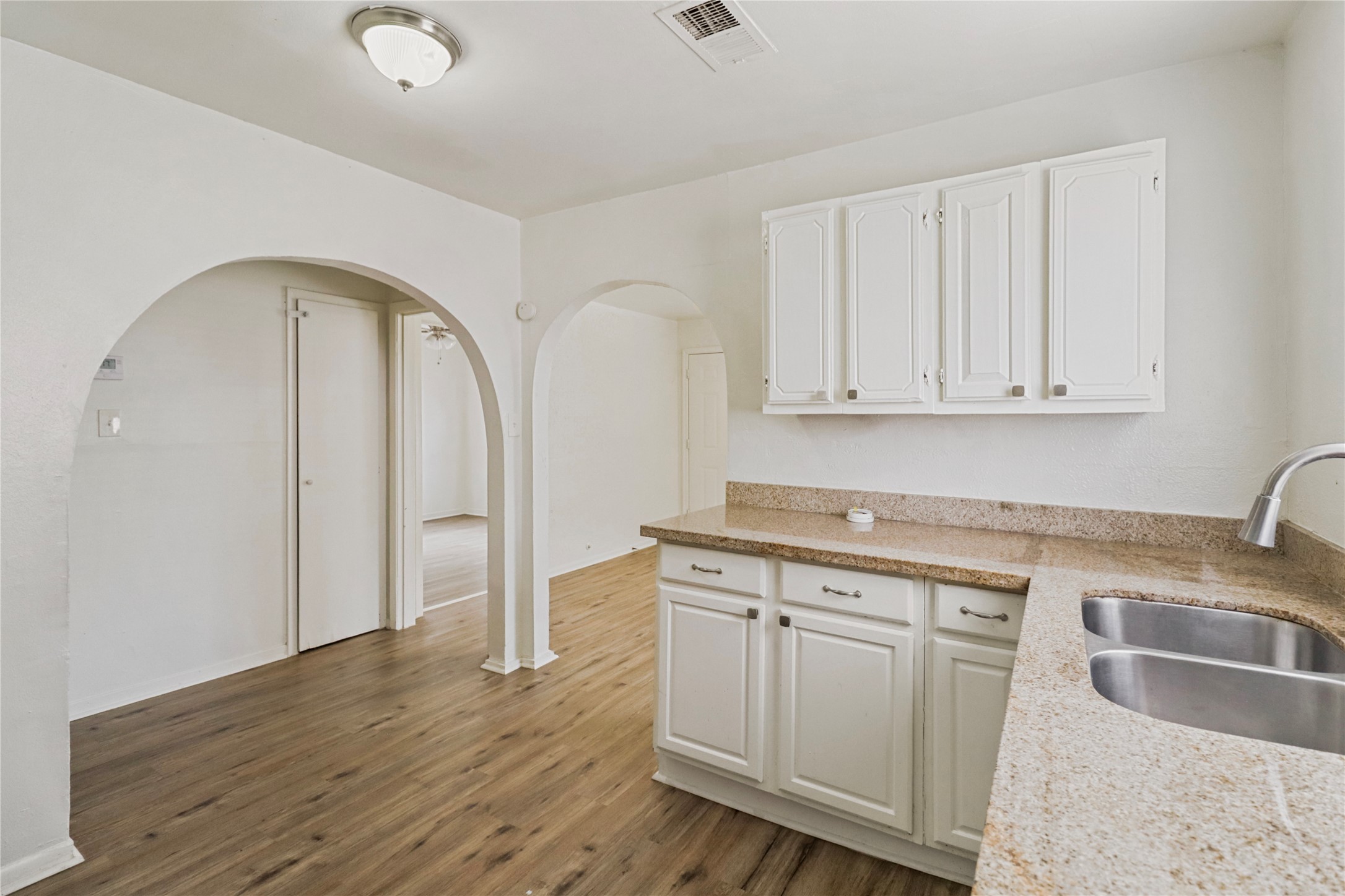 604 West Peach Street Angleton, TX 77515 - Photo 9 of 15 a kitchen with stainless steel appliances granite countertop a sink a stove a refrigerator and cabinets
