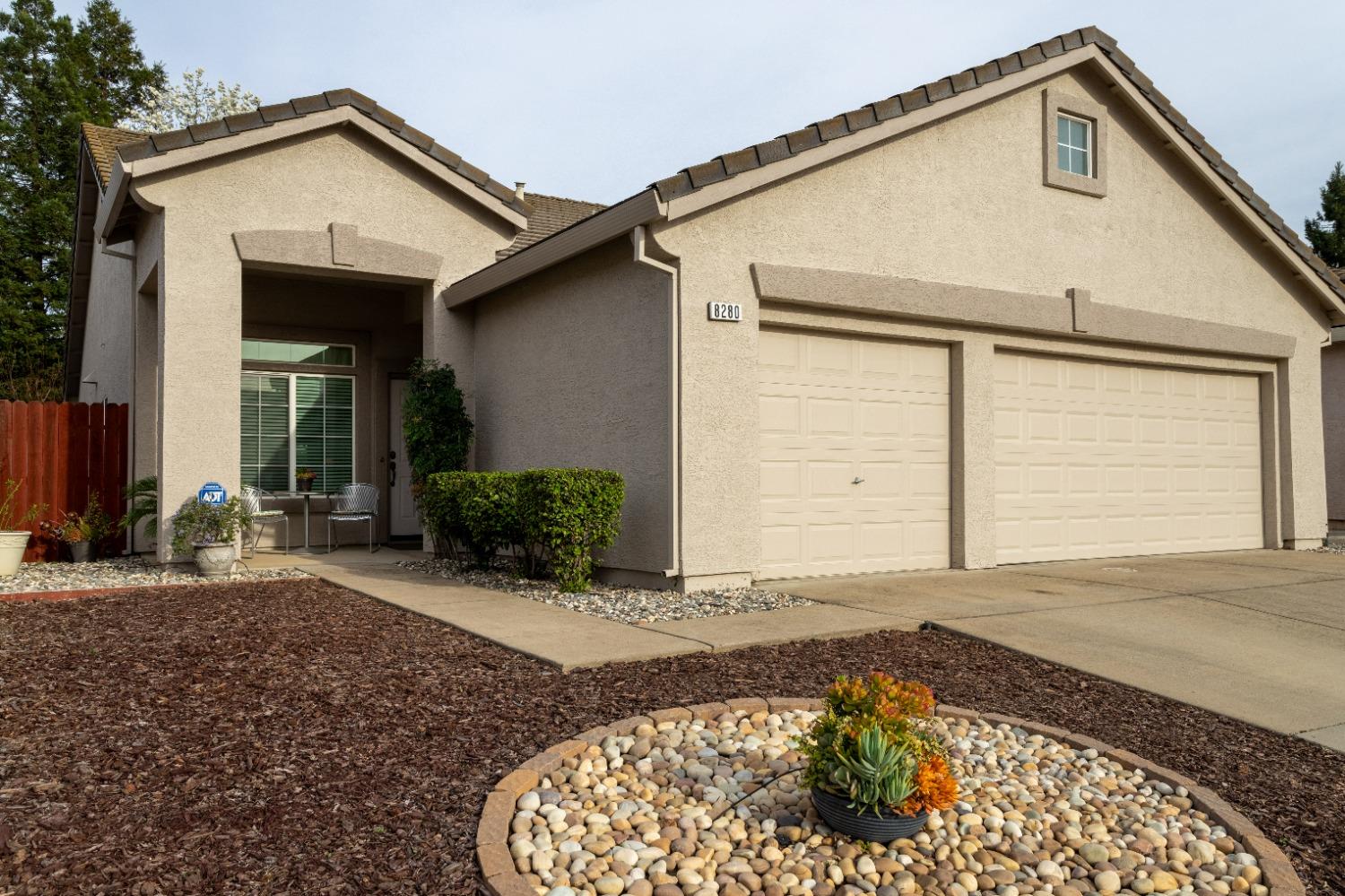 8280 Primoak Way Elk Grove, CA 95758 - Photo 1 of 1 a front view of a house with a yard