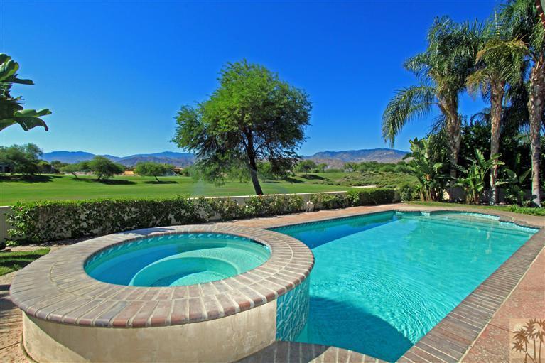 286 Loch Lomond Road Rancho Mirage, CA 92270 - Photo 1 of 24 a view of a swimming pool and a yard