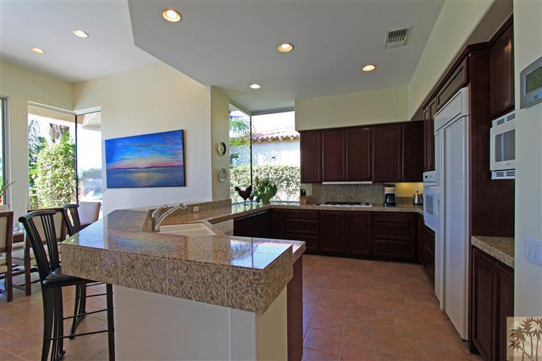 286 Loch Lomond Road Rancho Mirage, CA 92270 - Photo 12 of 24 a kitchen with granite countertop lots of counter top space
