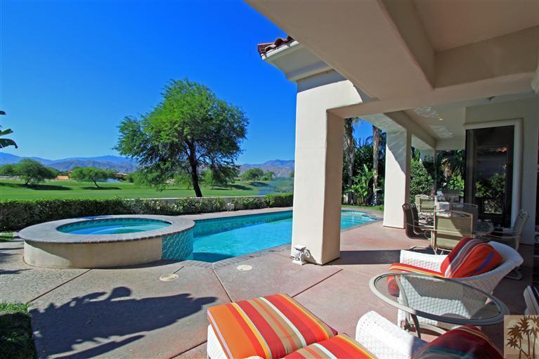 286 Loch Lomond Road Rancho Mirage, CA 92270 - Photo 20 of 24 a view of a patio with couches table and chairs with plants and wooden fence