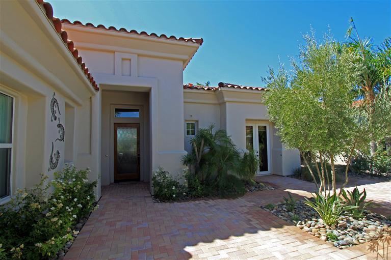 286 Loch Lomond Road Rancho Mirage, CA 92270 - Photo 3 of 24 a front view of house with yard and green space
