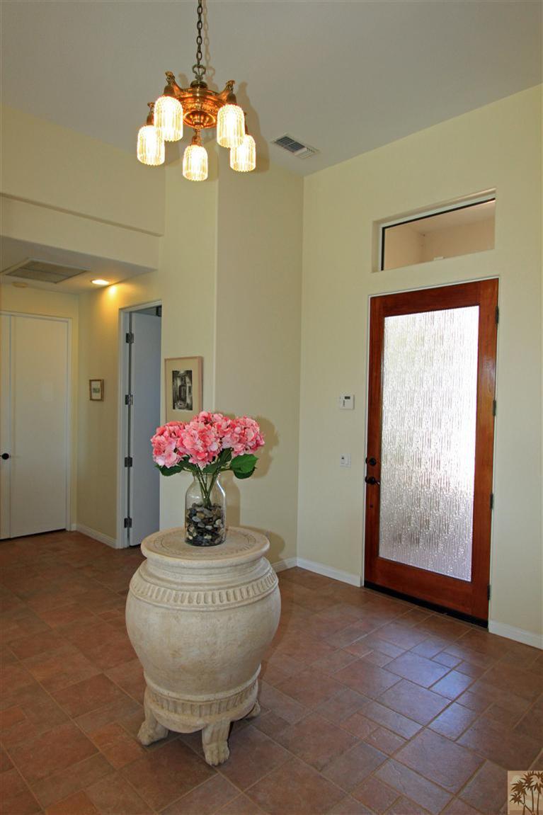 286 Loch Lomond Road Rancho Mirage, CA 92270 - Photo 6 of 24 a room with a chandelier fan and a rug