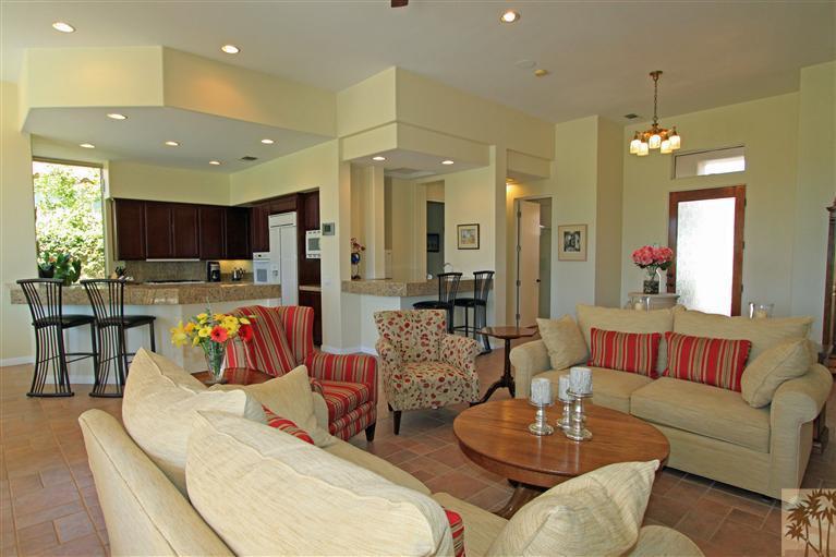 286 Loch Lomond Road Rancho Mirage, CA 92270 - Photo 9 of 24 a living room with furniture kitchen view and a chandelier