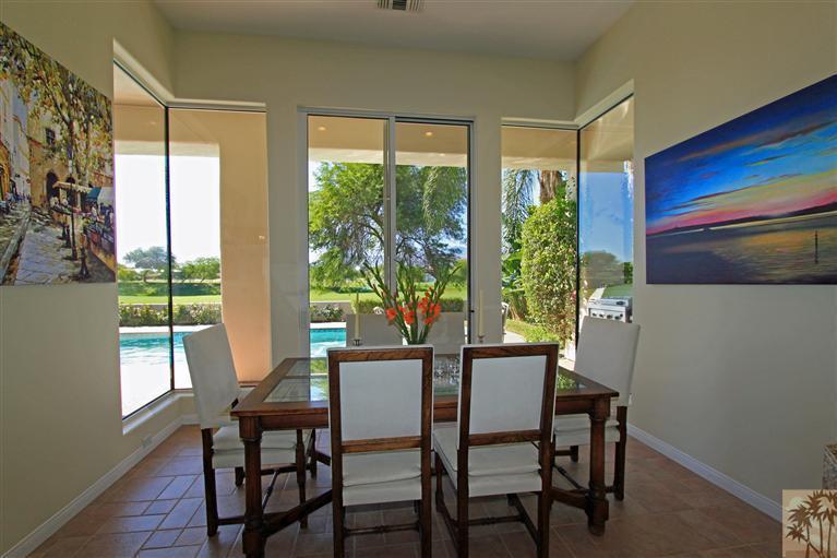 286 Loch Lomond Road Rancho Mirage, CA 92270 - Photo 10 of 24 a view of a dining room with furniture window and wooden floor