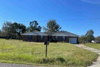a house with a yard in front of it
