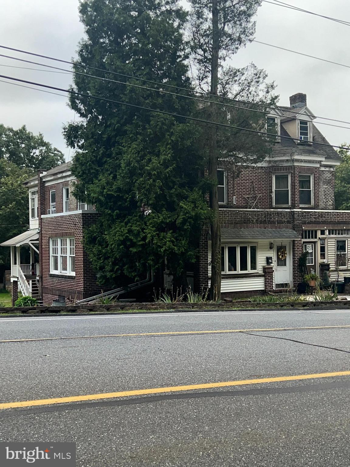25 Broad Street Ashland, PA 17921 - Photo 1 of 138 a front view of a house with a yard