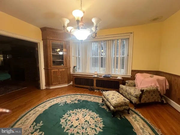 a view of entryway and wooden floor
