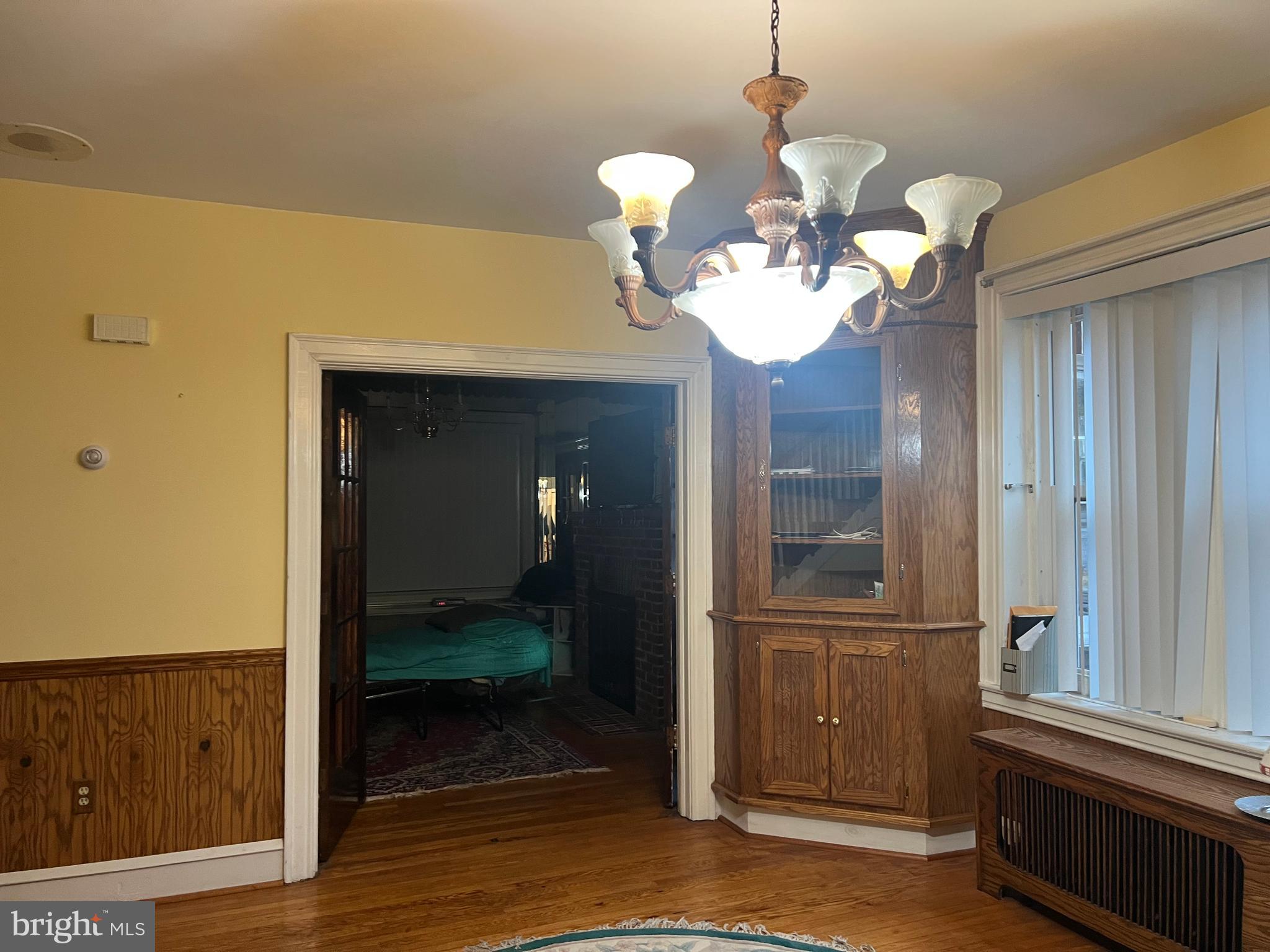 25 Broad Street Ashland, PA 17921 - Photo 20 of 138 a view of a hallway with wooden floor and a chandelier