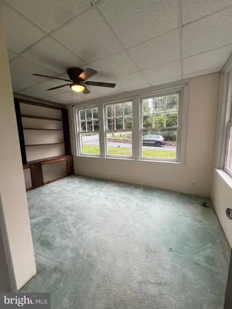 a view of an empty room with a balcony