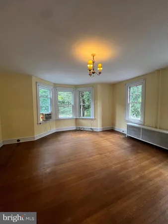 a view of a room with gym equipment and a window