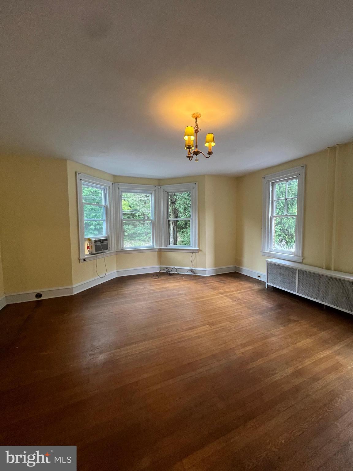 25 Broad Street Ashland, PA 17921 - Photo 42 of 138 an empty room with windows and chandelier fan