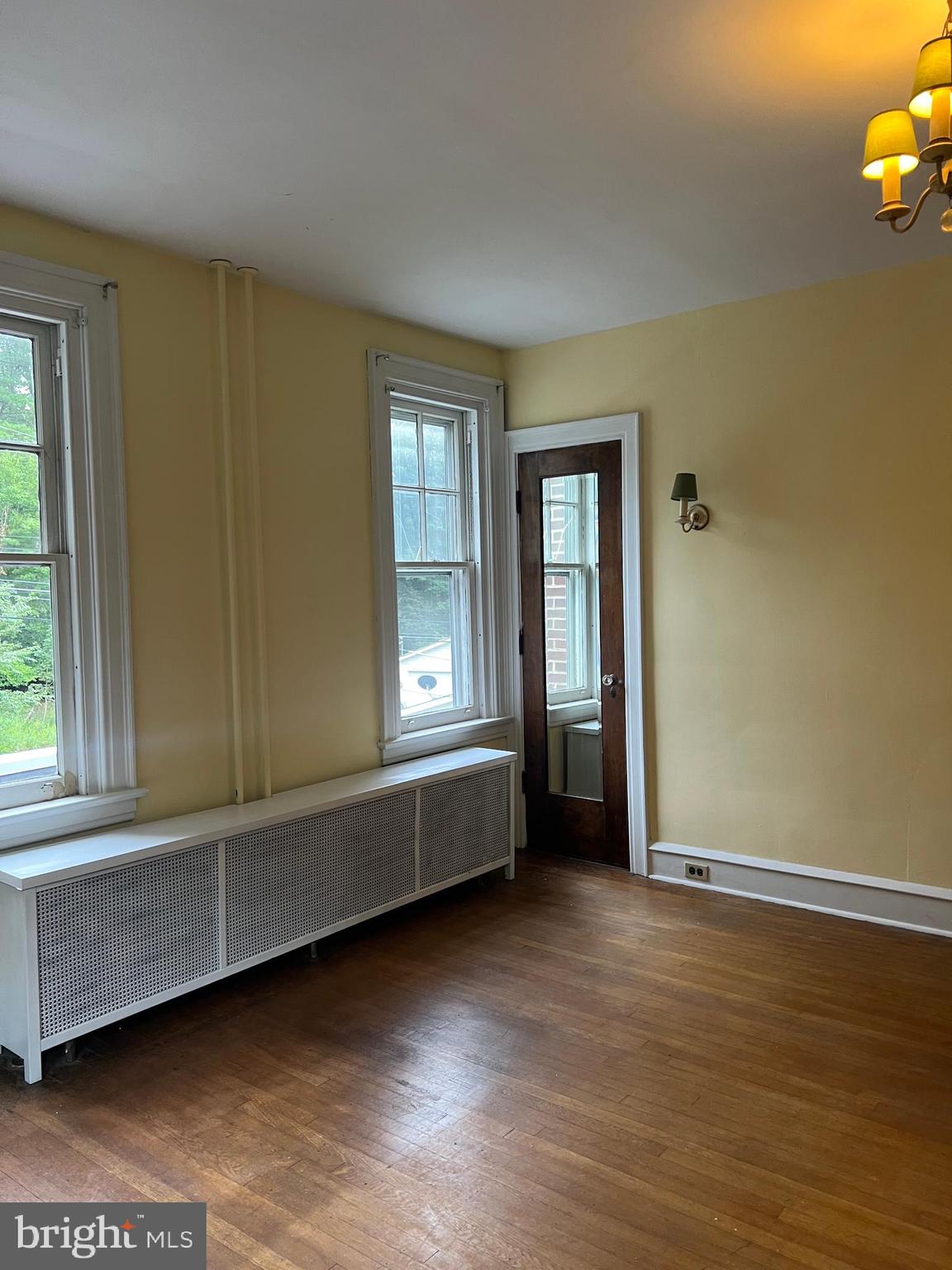 25 Broad Street Ashland, PA 17921 - Photo 44 of 138 a view of an empty room with wooden floor and a window