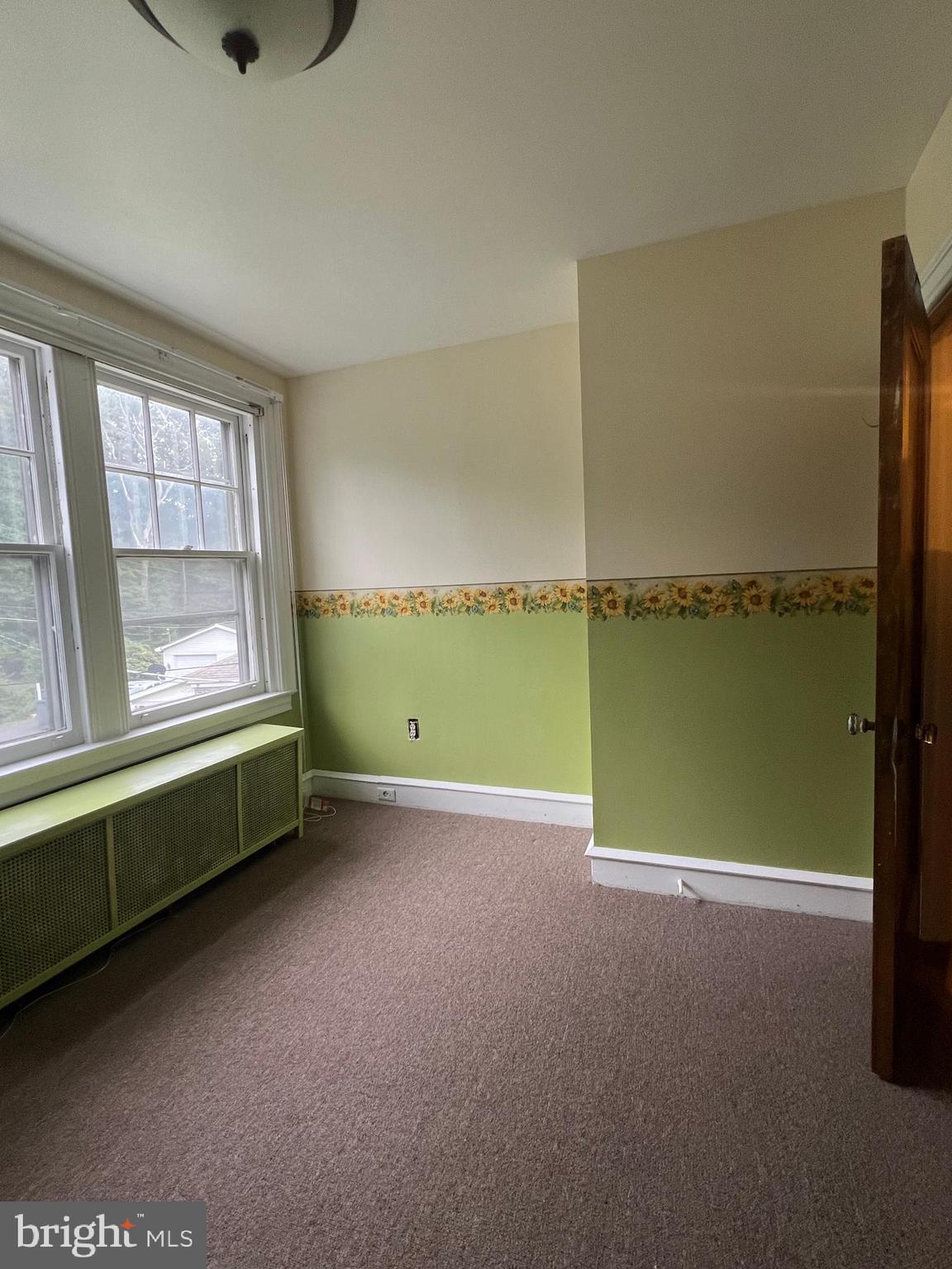 25 Broad Street Ashland, PA 17921 - Photo 49 of 138 a view of an empty room with a window and kitchen view