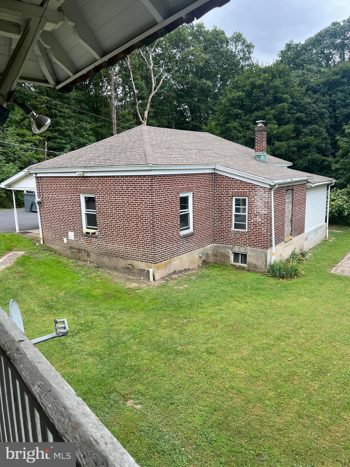 25 Broad Street Ashland, PA 17921 - Photo 93 of 138 a view of a backyard with plants and large tree