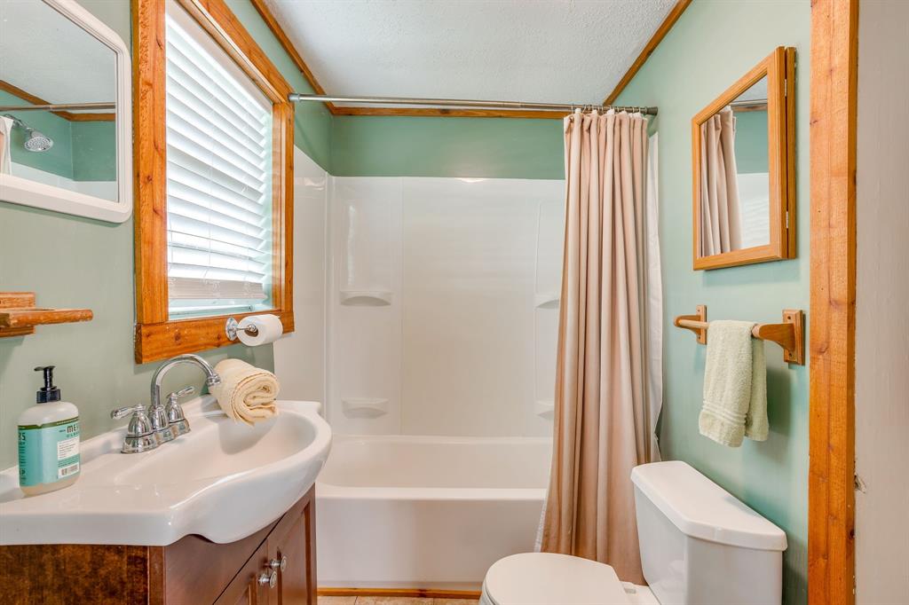 13350 Miller Road Azle, TX 76020 - Photo 12 of 40 a bathroom with a sink toilet and shower