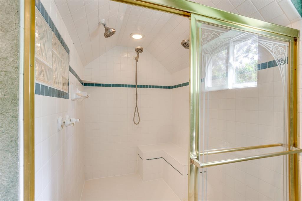 13350 Miller Road Azle, TX 76020 - Photo 31 of 40 a bathroom with a glass shower door and a window