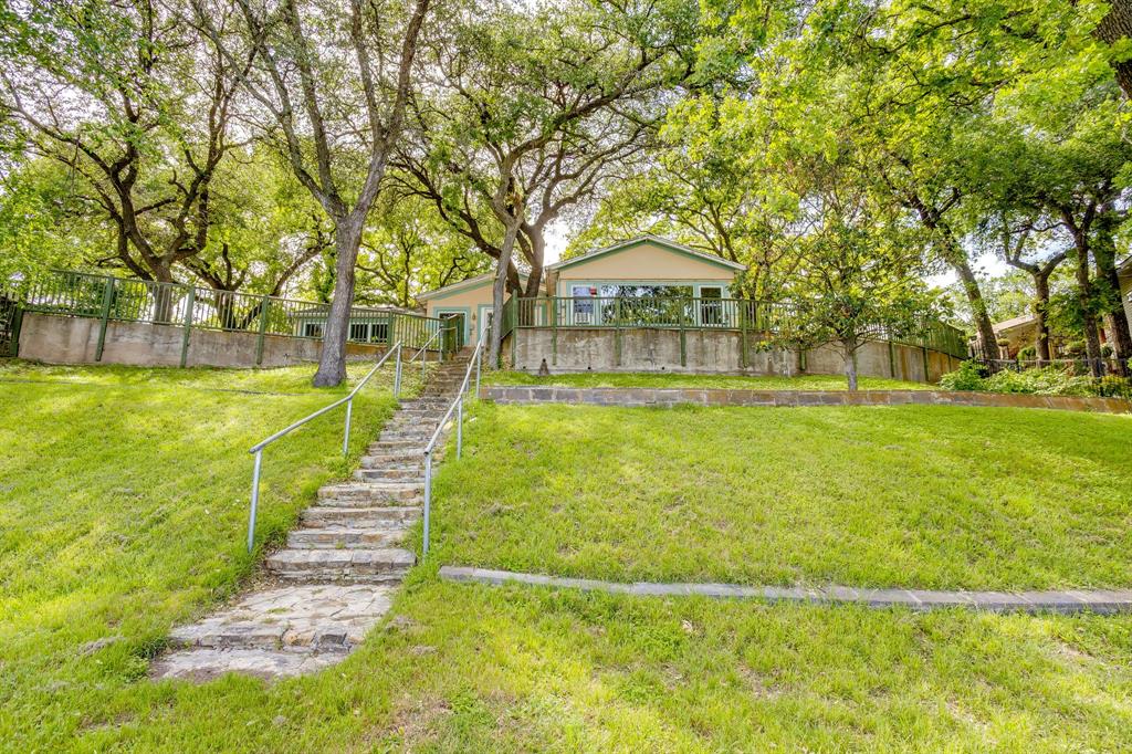 13350 Miller Road Azle, TX 76020 - Photo 39 of 40 a view of swimming pool with lawn chairs and large trees