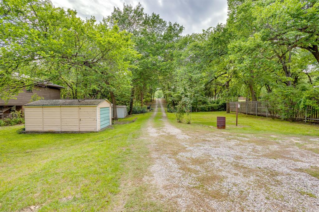 13350 Miller Road Azle, TX 76020 - Photo 8 of 40 a view of a backyard with a small house