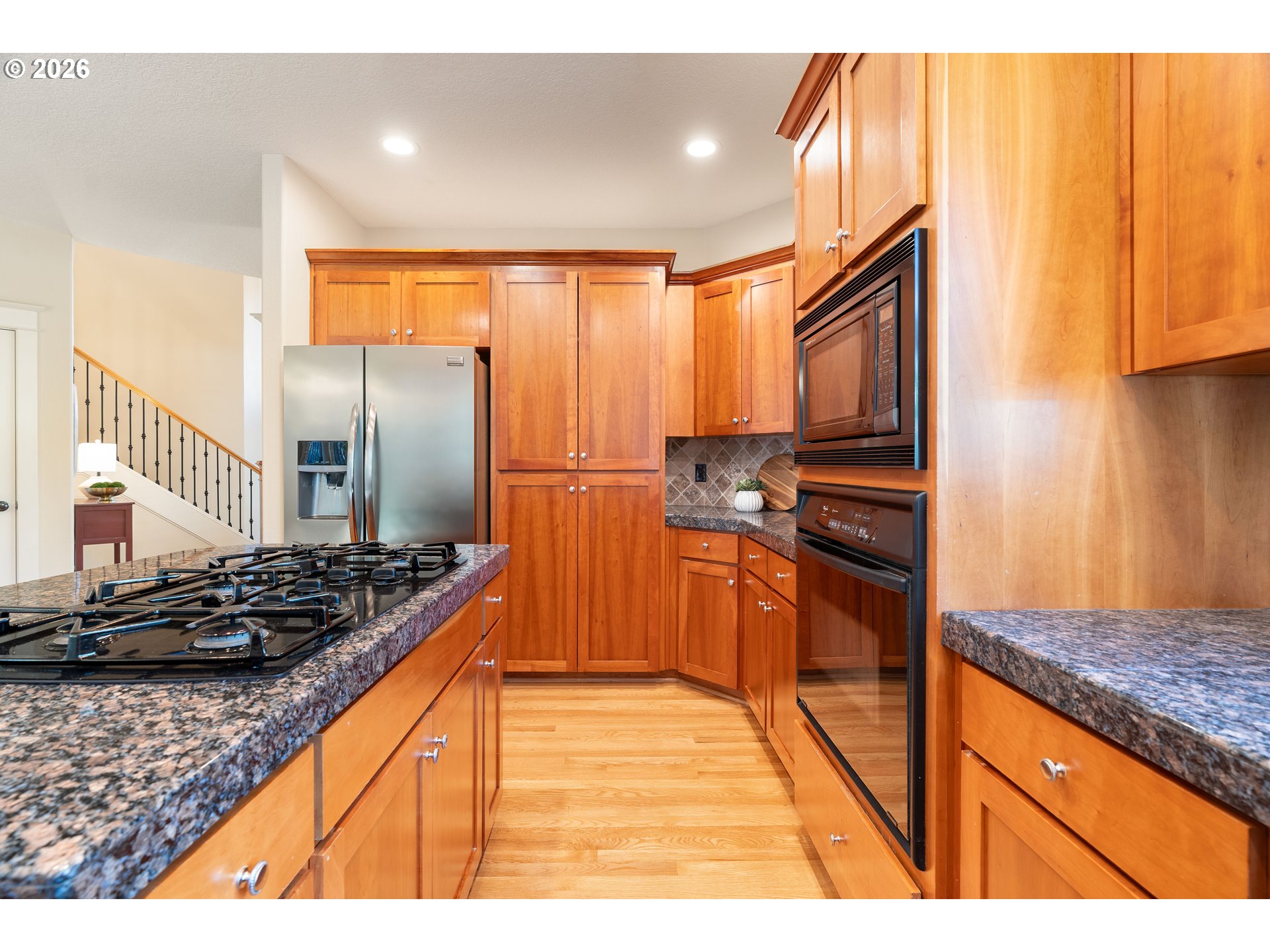 3578 Northwest Gerritz Terrace Portland, OR 97229 - Photo 13 of 47 a kitchen with stainless steel appliances granite countertop a stove a sink and a refrigerator