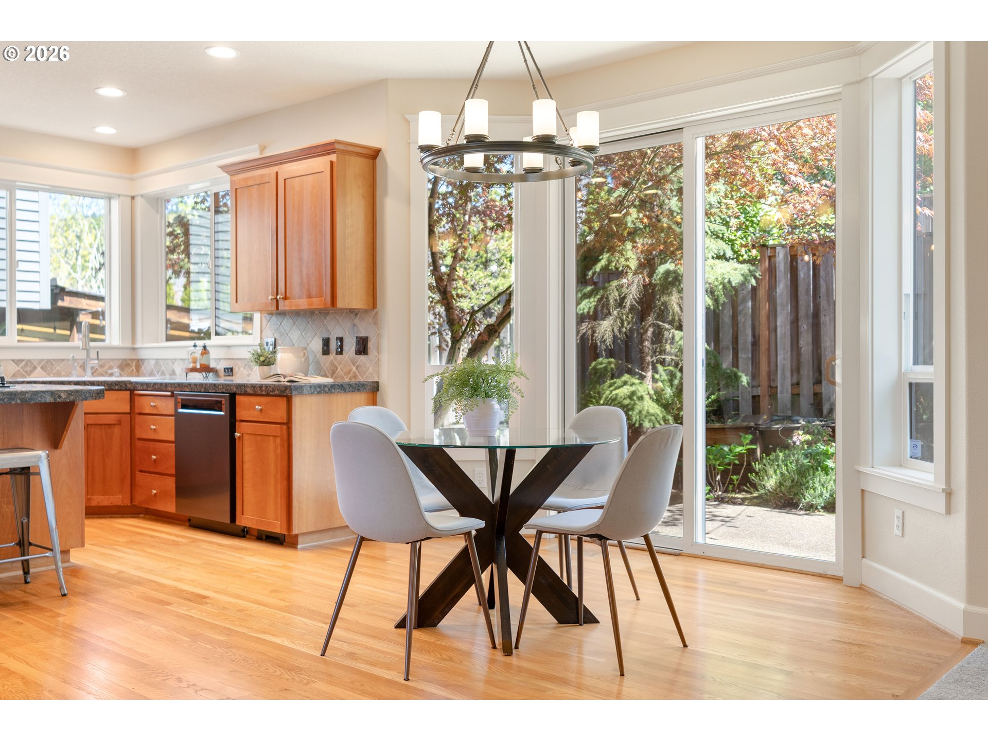 3578 Northwest Gerritz Terrace Portland, OR 97229 - Photo 15 of 47 a dining room with furniture a chandelier and wooden floor