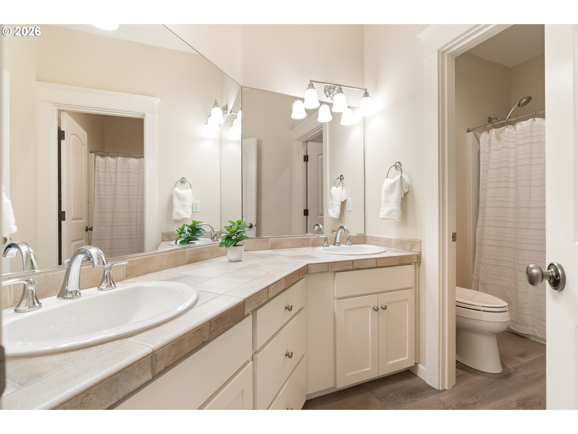 3578 Northwest Gerritz Terrace Portland, OR 97229 - Photo 34 of 47 a bathroom with a double vanity sink toilet and a mirror