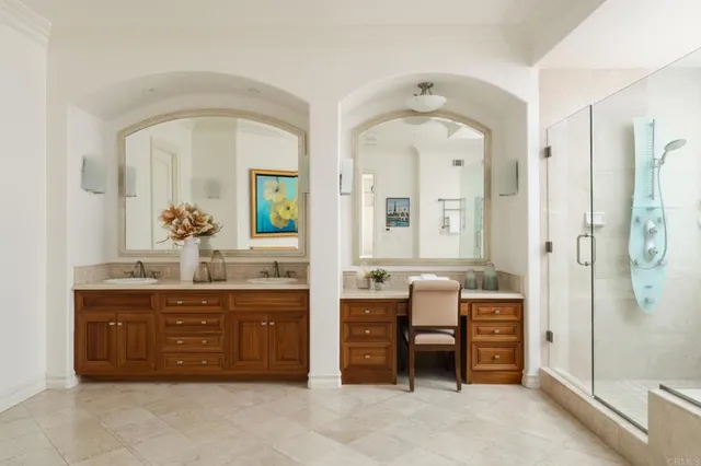 a spacious bathroom with a granite countertop sink a mirror and a