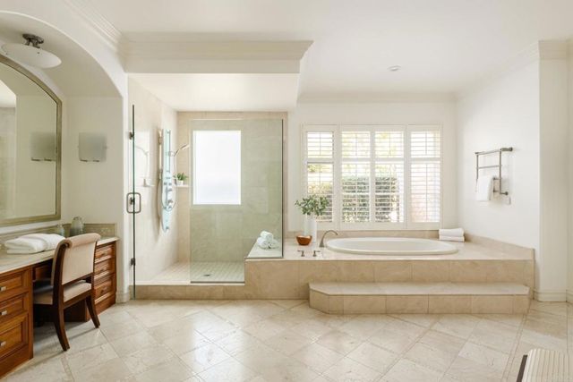 a spacious bathroom with sink and bathtub