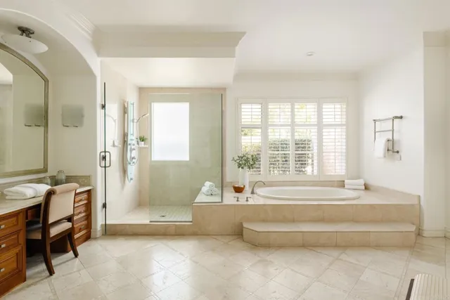 a spacious bathroom with sink and bathtub