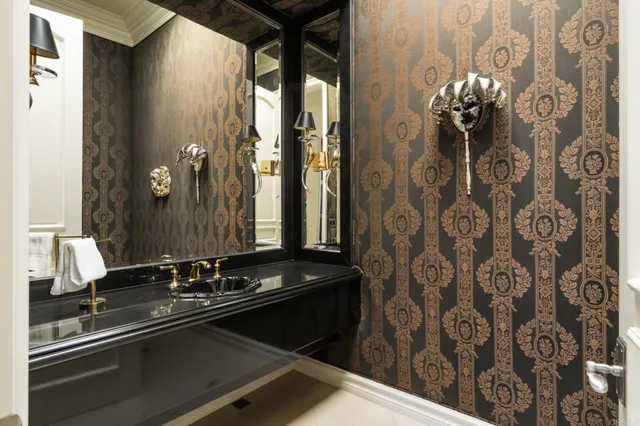 a room with a mirror and a sink