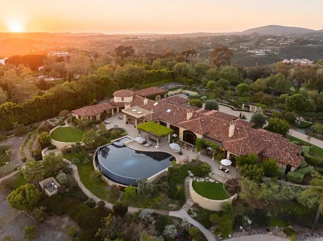 an aerial view of residential house and outdoor space
