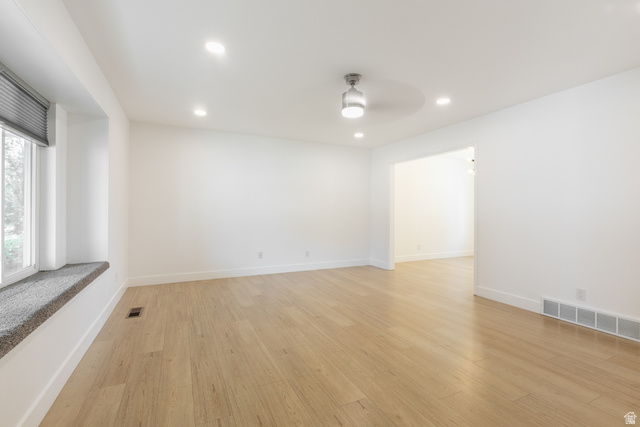 11906 Woodridge Road Sandy, UT 84094 - Photo 6 of 35 Living area featuring light wood-finish flooring, recessed lighting, and a modern ceiling fan