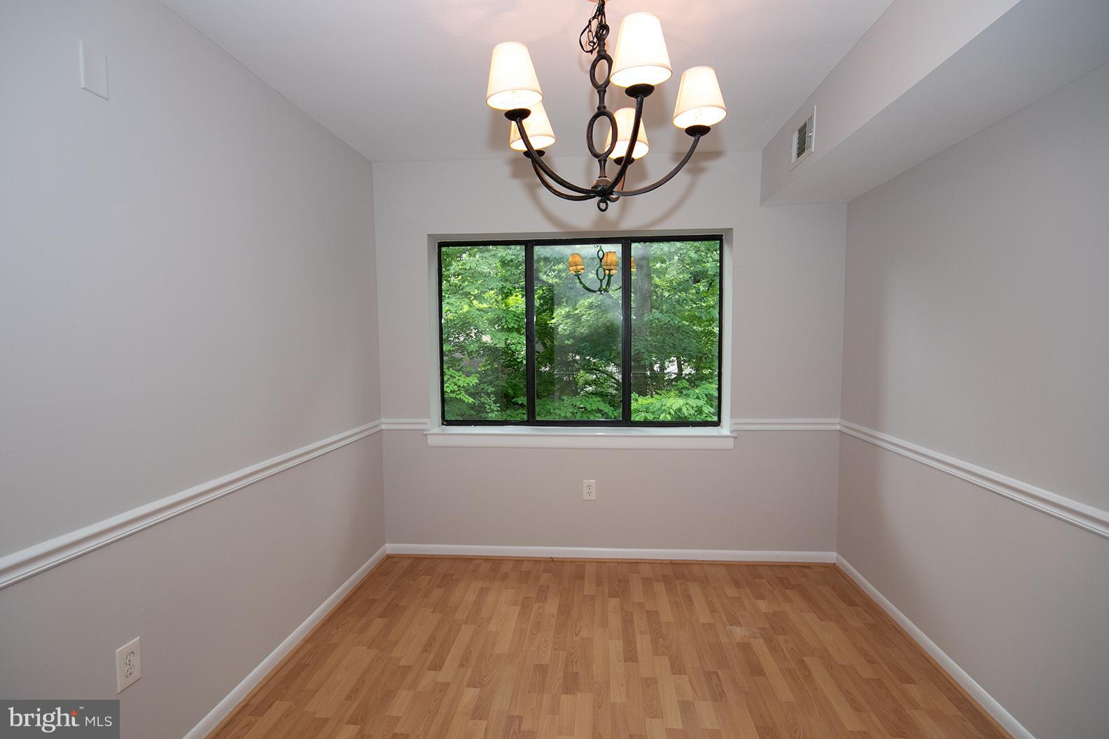 11727 Ledura Court, Unit 201 Reston, VA 20191 - Photo 11 of 29 an empty room with a window