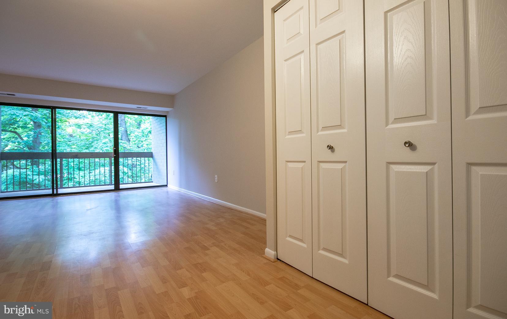 11727 Ledura Court, Unit 201 Reston, VA 20191 - Photo 3 of 29 a view of empty room with wooden floor and fan
