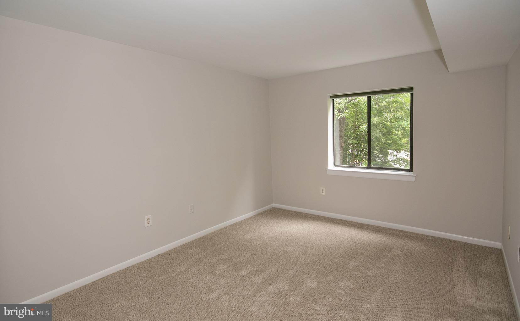 11727 Ledura Court, Unit 201 Reston, VA 20191 - Photo 22 of 29 an empty room with windows