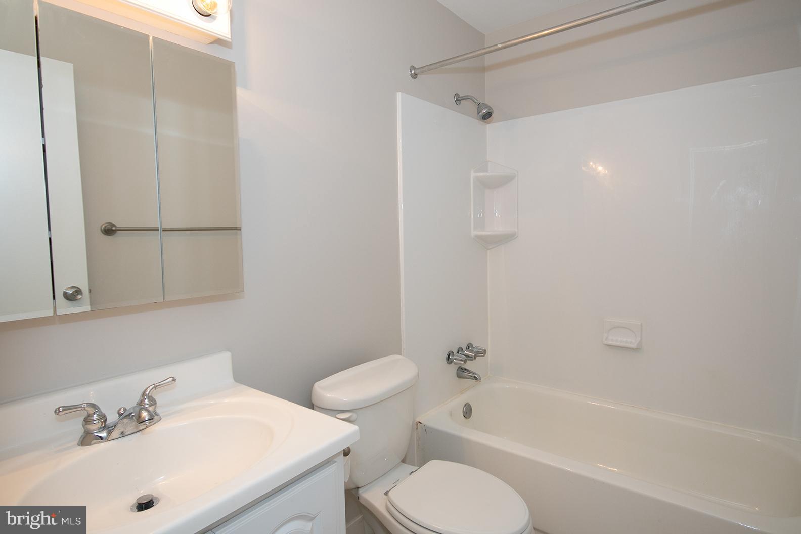 11727 Ledura Court, Unit 201 Reston, VA 20191 - Photo 25 of 29 a bathroom with a sink toilet and shower