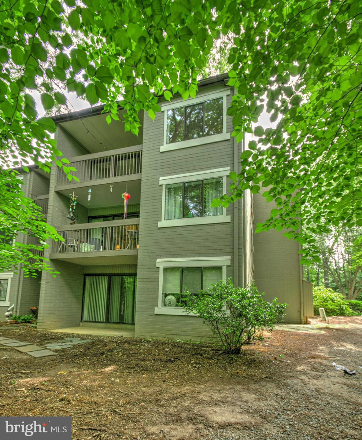 11727 Ledura Court, Unit 201 Reston, VA 20191 - Photo 27 of 29 a view of a house with a yard