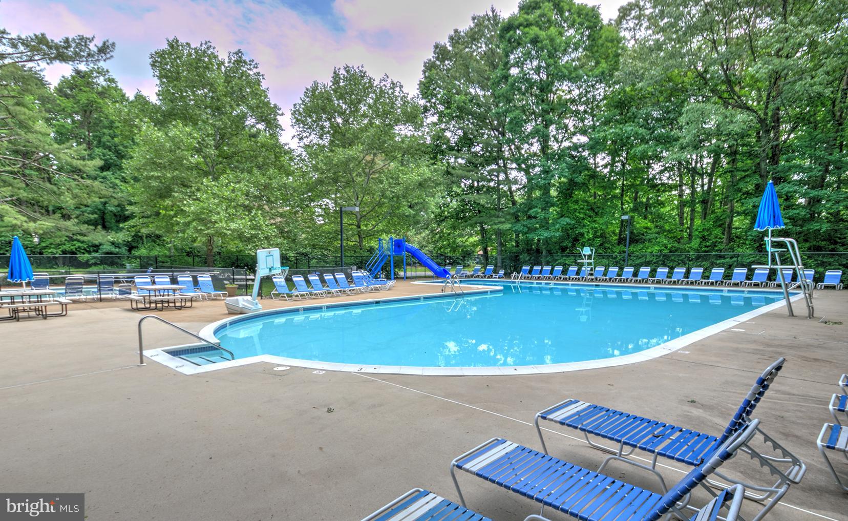 11727 Ledura Court, Unit 201 Reston, VA 20191 - Photo 29 of 29 a view of a swimming pool with a lounge chair