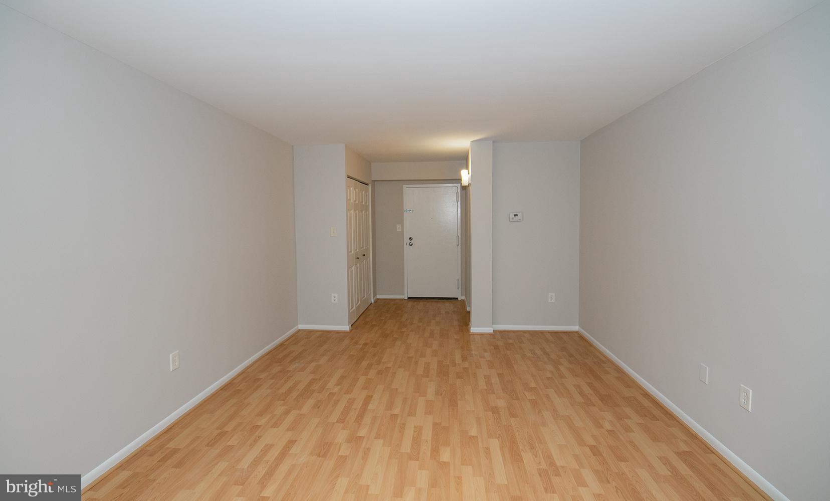 11727 Ledura Court, Unit 201 Reston, VA 20191 - Photo 5 of 29 a view of empty room with wooden floor