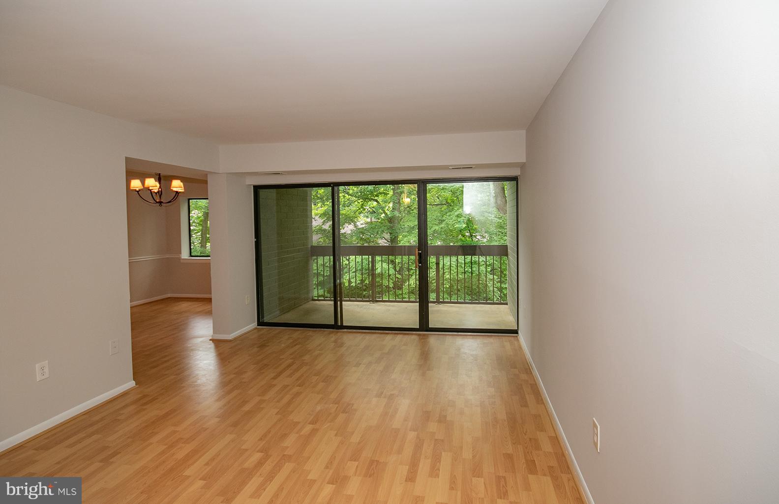 11727 Ledura Court, Unit 201 Reston, VA 20191 - Photo 7 of 29 a view of a room with wooden floor and a window