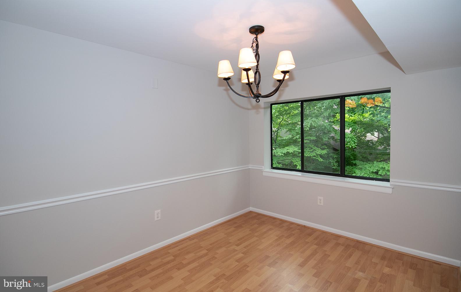 11727 Ledura Court, Unit 201 Reston, VA 20191 - Photo 10 of 29 an empty room with a window