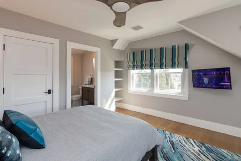 a bedroom with a bed and window