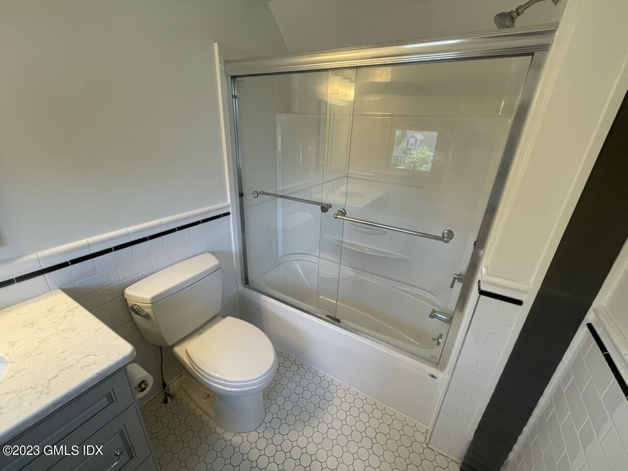 37 Orchard Street, Unit B Cos Cob, CT 06807 - Photo 12 of 15 a bathroom with a toilet and a shower
