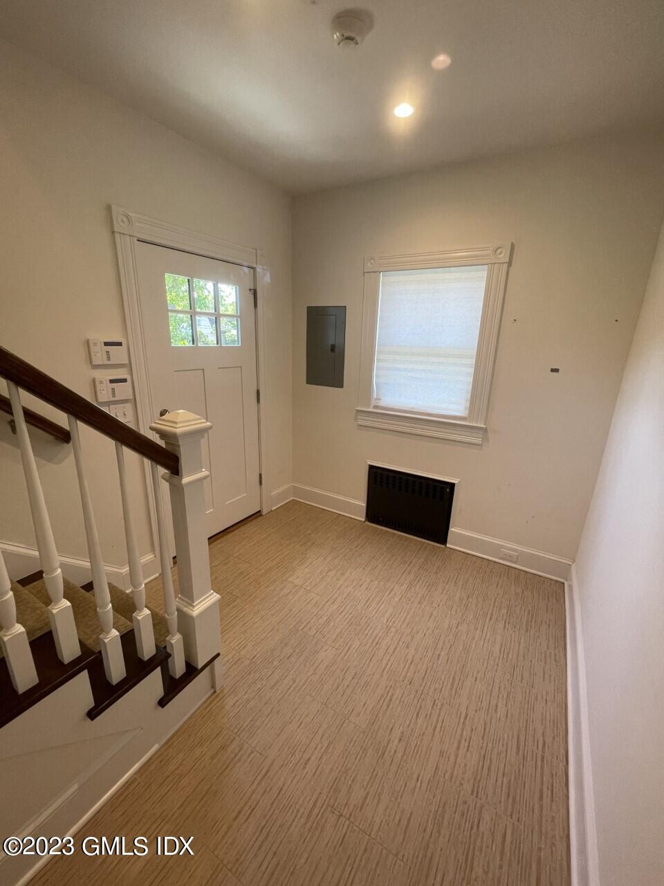 37 Orchard Street, Unit B Cos Cob, CT 06807 - Photo 3 of 15 a view of front door with stairs