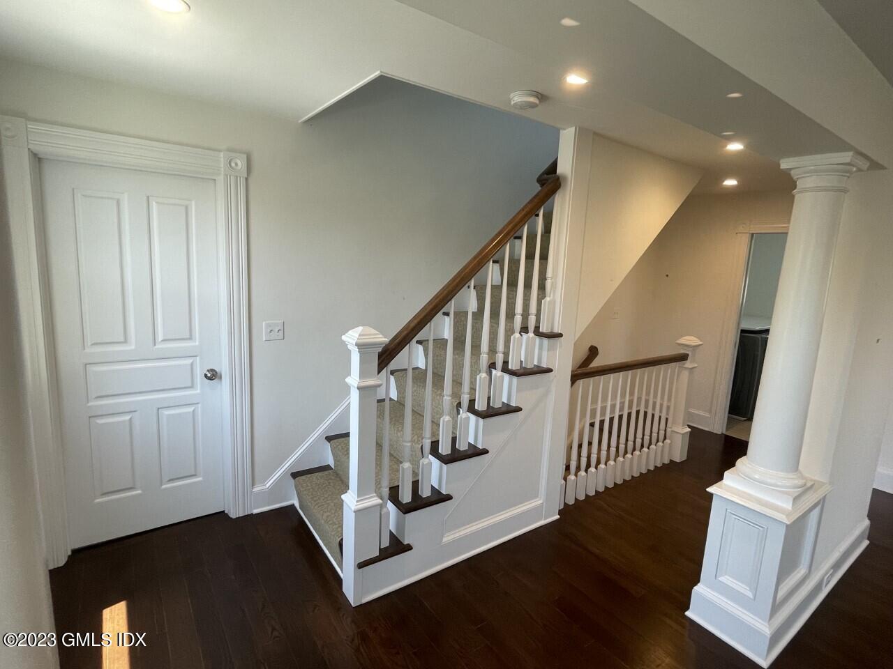 37 Orchard Street, Unit B Cos Cob, CT 06807 - Photo 8 of 15 a view of entryway with wooden floor and stairs